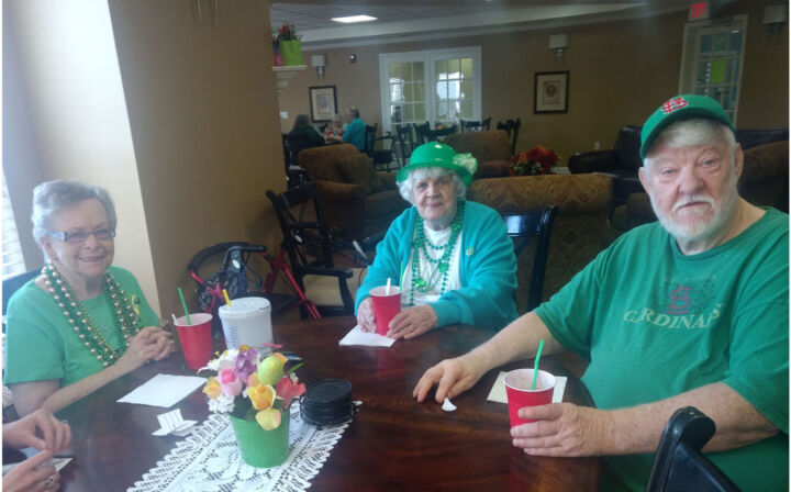 The Wyndham Park residents gather in their St. Patrick’s Day attire for their annual party.