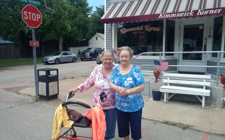 Lois and Diane, Wyndham Park residents, pose in front of Kimmswick Korner.