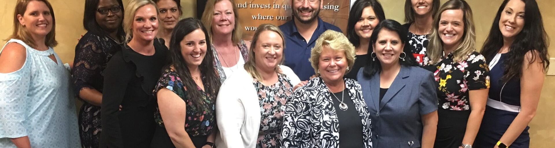 Employees standing together during training