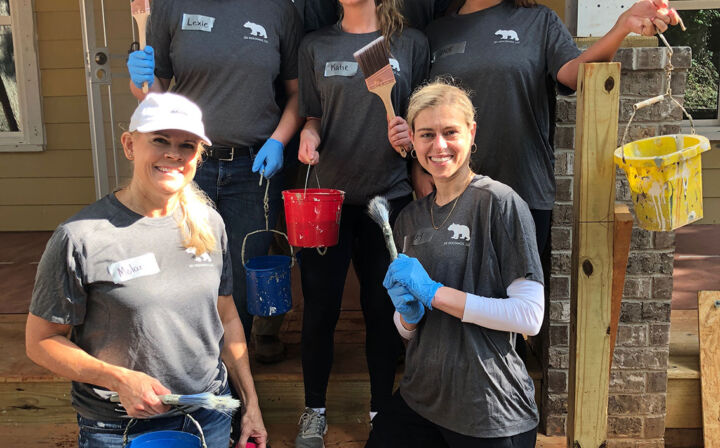 Women standing together with tools