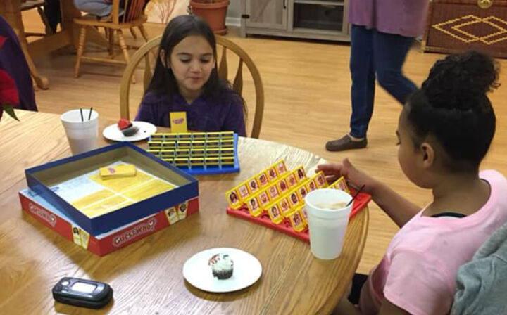 Residents of Portales Properties gathered together for game night in the community room on December 18, 2018.