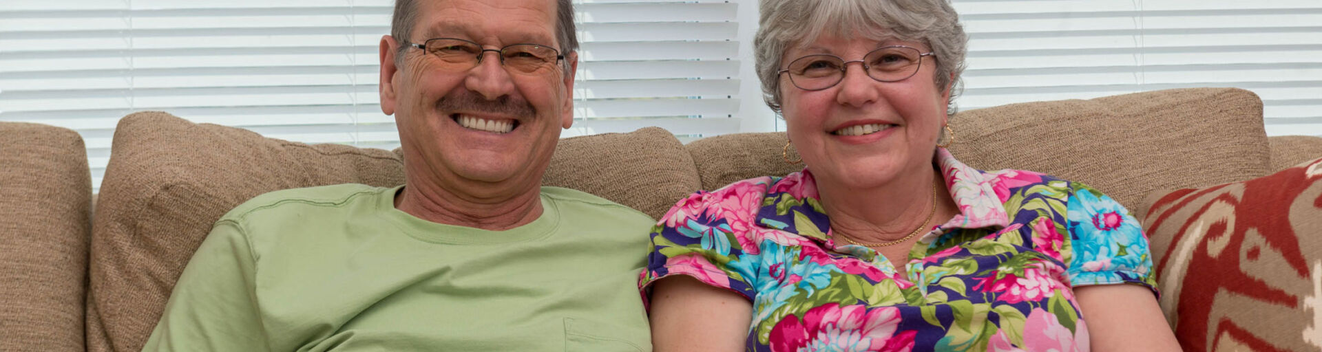 Edward and Debra Dille relax together in the Sawmill Landing community room.