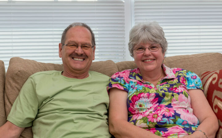 Edward and Debra Dille relax together in the Sawmill Landing community room.