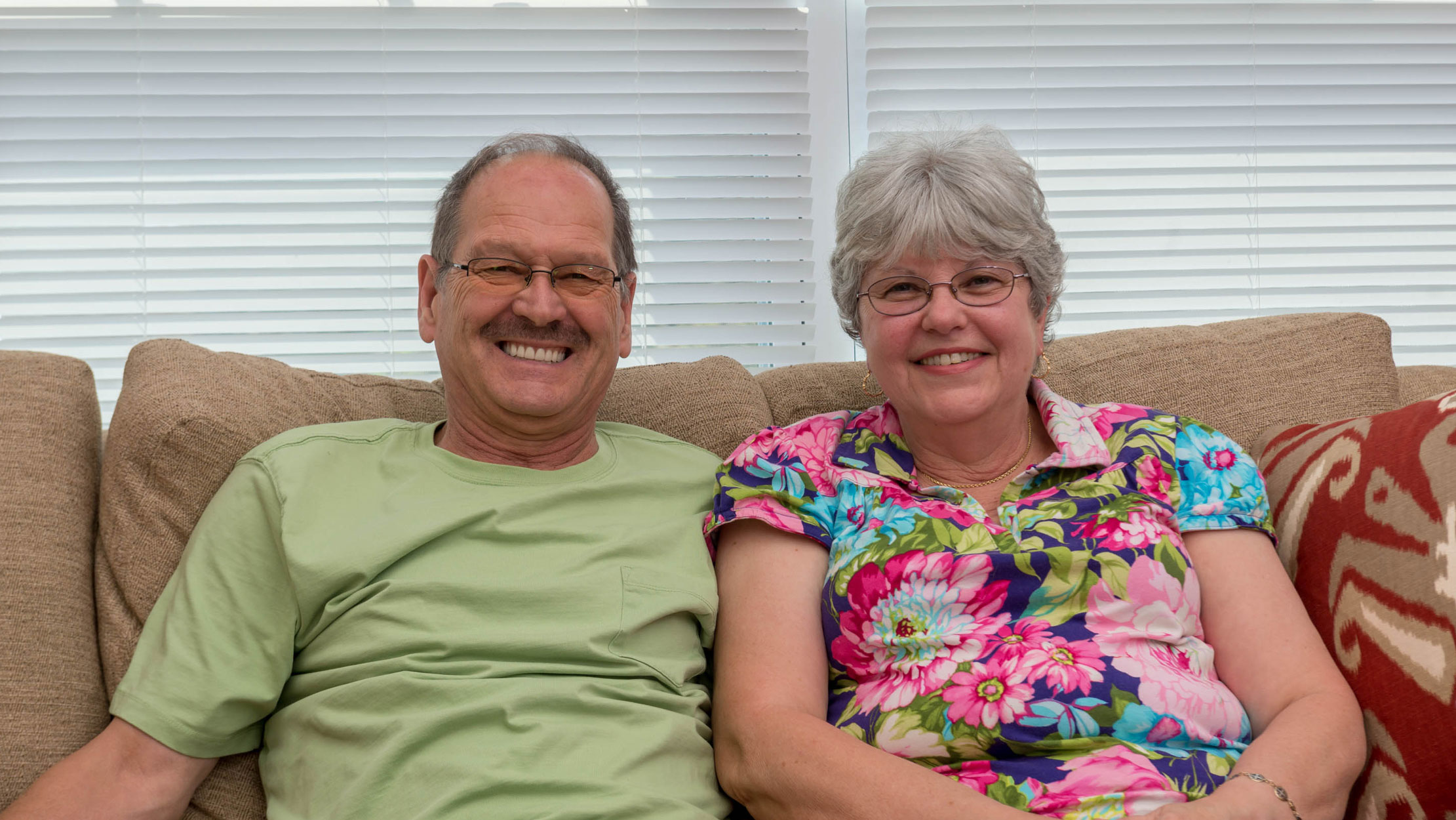 Edward and Debra Dille relax together in the Sawmill Landing community room.
