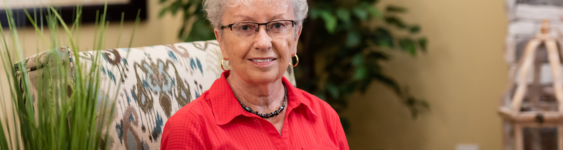 Barbara Froh relaxes in the community room at Wisteria Place.