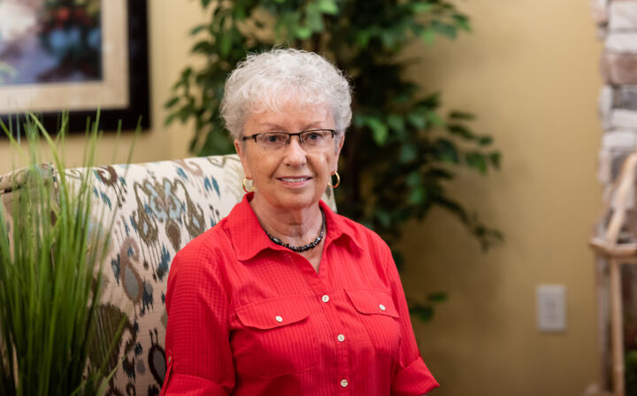 Barbara Froh relaxes in the community room at Wisteria Place.